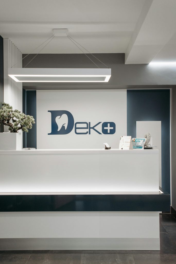 pexels photo 6809645 6809645 Clean and modern dental clinic reception area with minimalist design and stylish lighting.